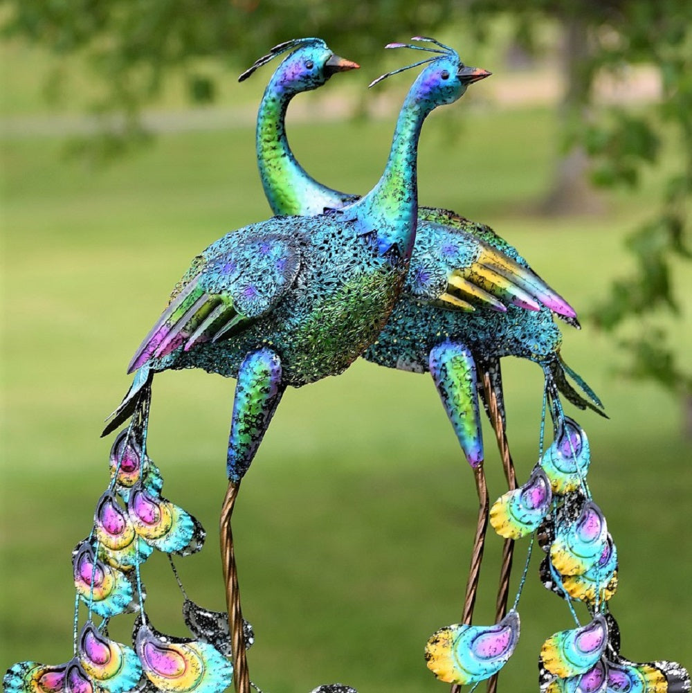 Set of 2 teal peacocks in a garden scene.