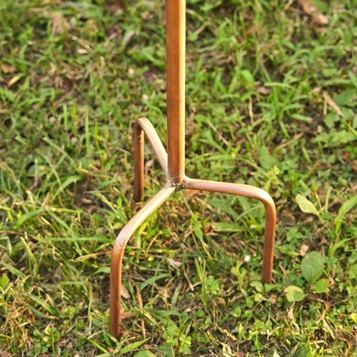 Metal garden fork on grass