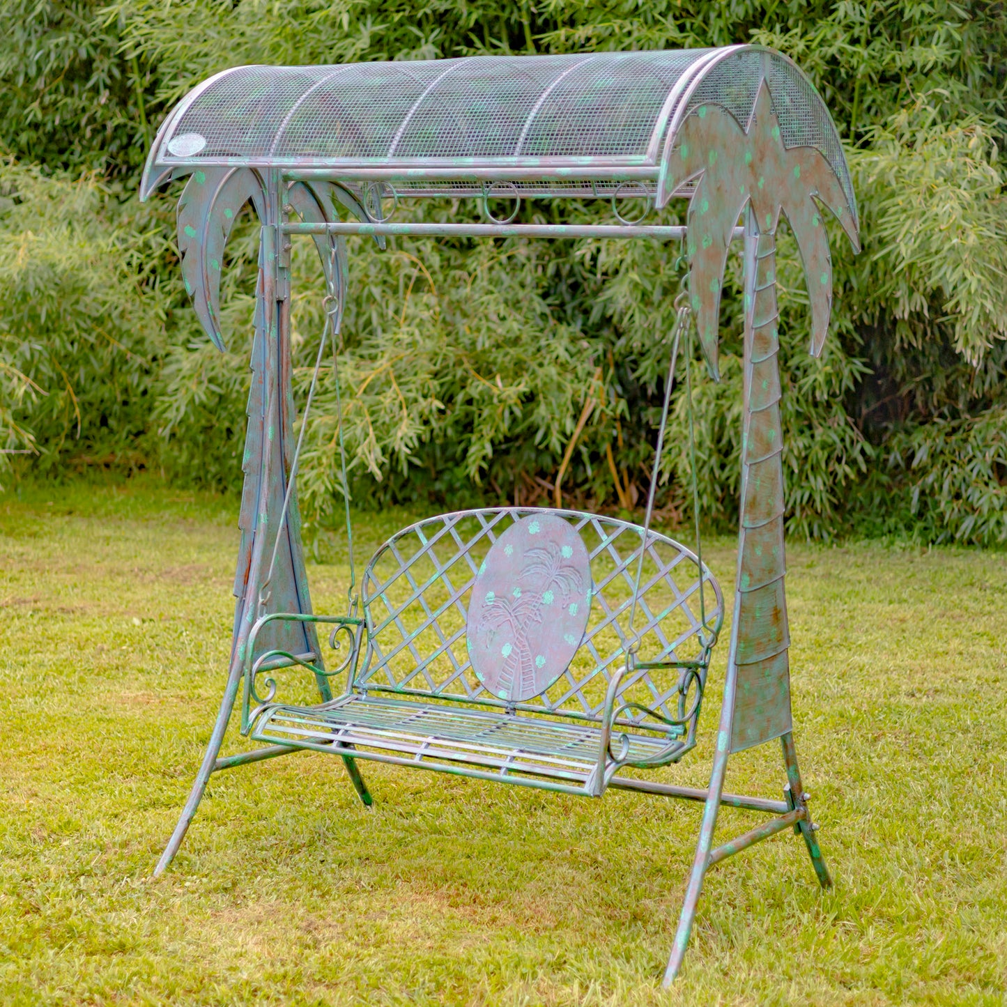 Metal garden swing with canopy on grassy area