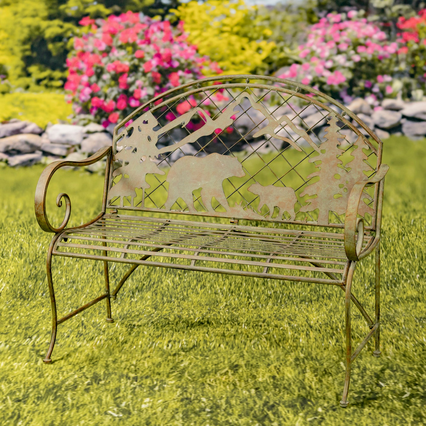 Decorative metal bench with animal cutouts on a grassy area with flowers in the background