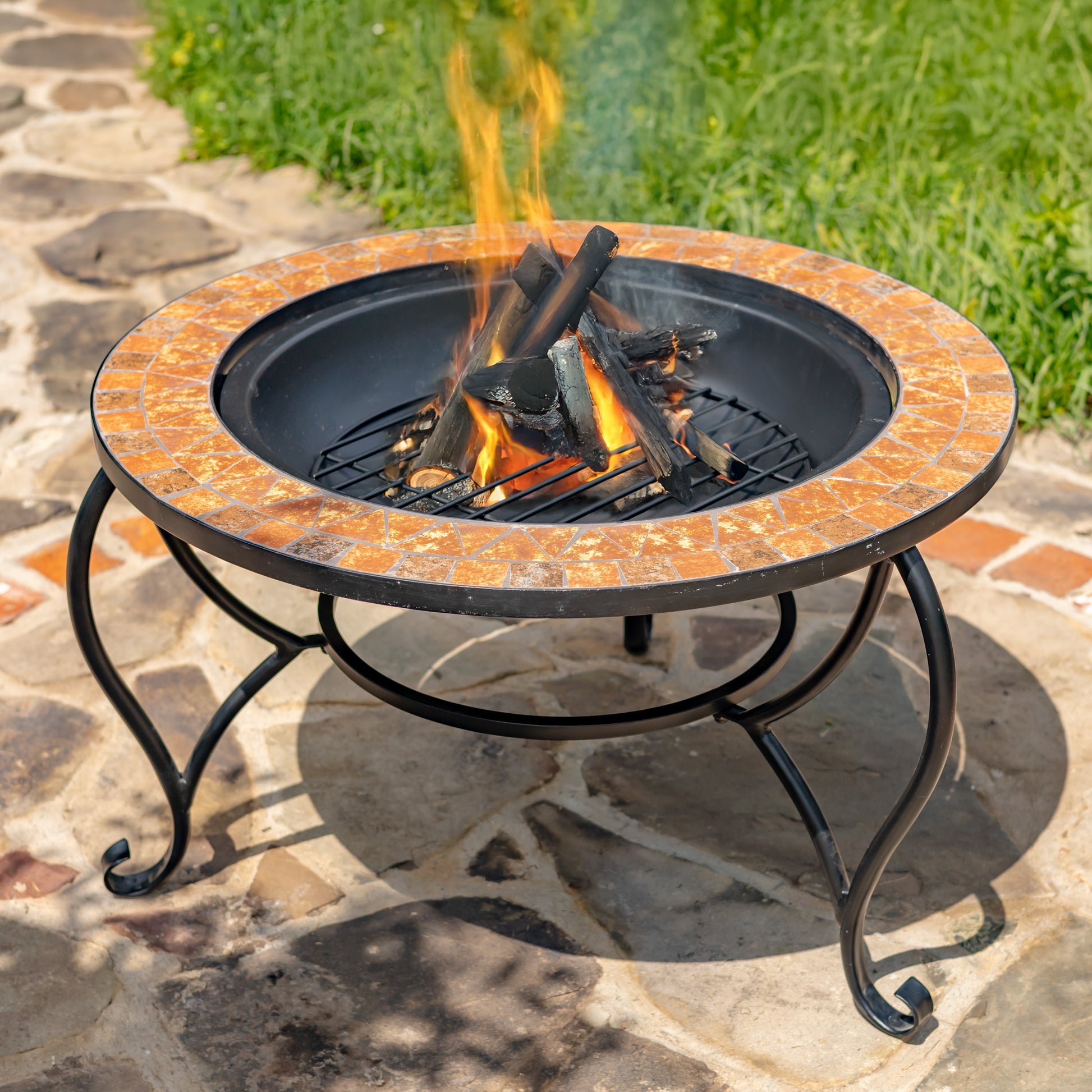 Fire pit with flames on a stone patio