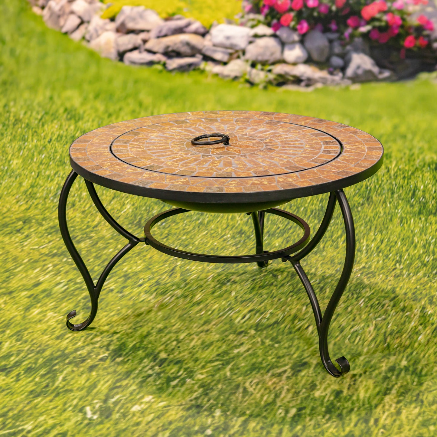 Round garden table with mosaic top on grass
