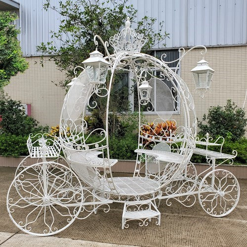 White egg shaped carriage bench and plant stand with lanterns