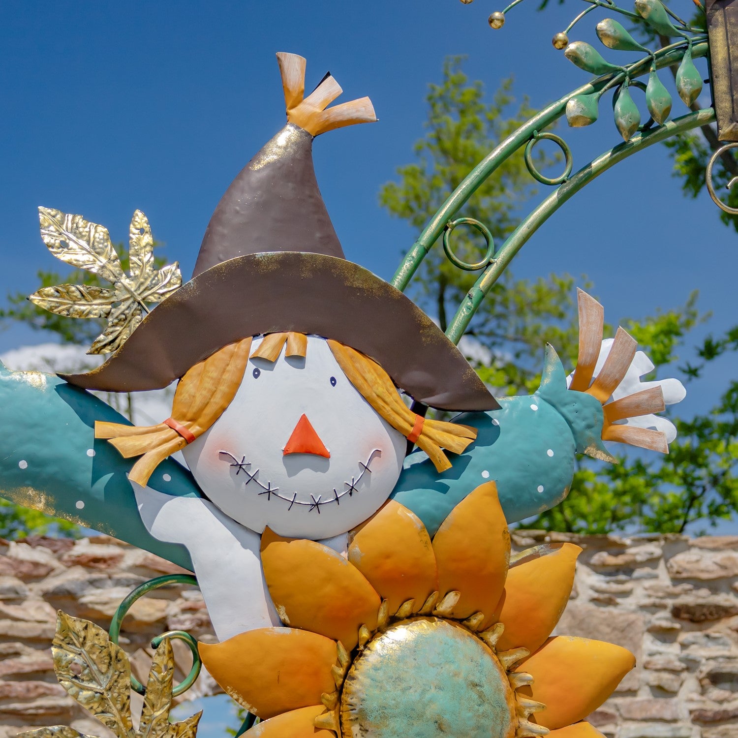 close up of scarecrow with brown hat and polka dot shirt