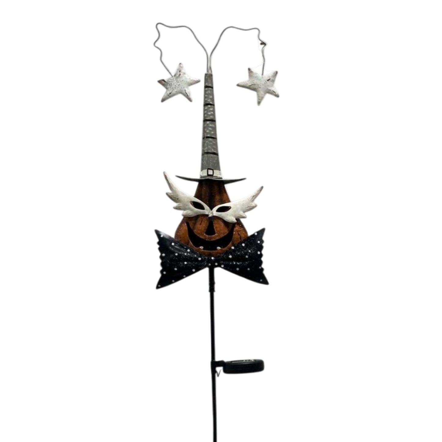 A Halloween garden stake decoration featuring a carved jack-o'-lantern face wearing a tall black witch hat, white feather-like accents, and a black bow tie with white star details, topped with two hanging silver stars on a thin metal stake.